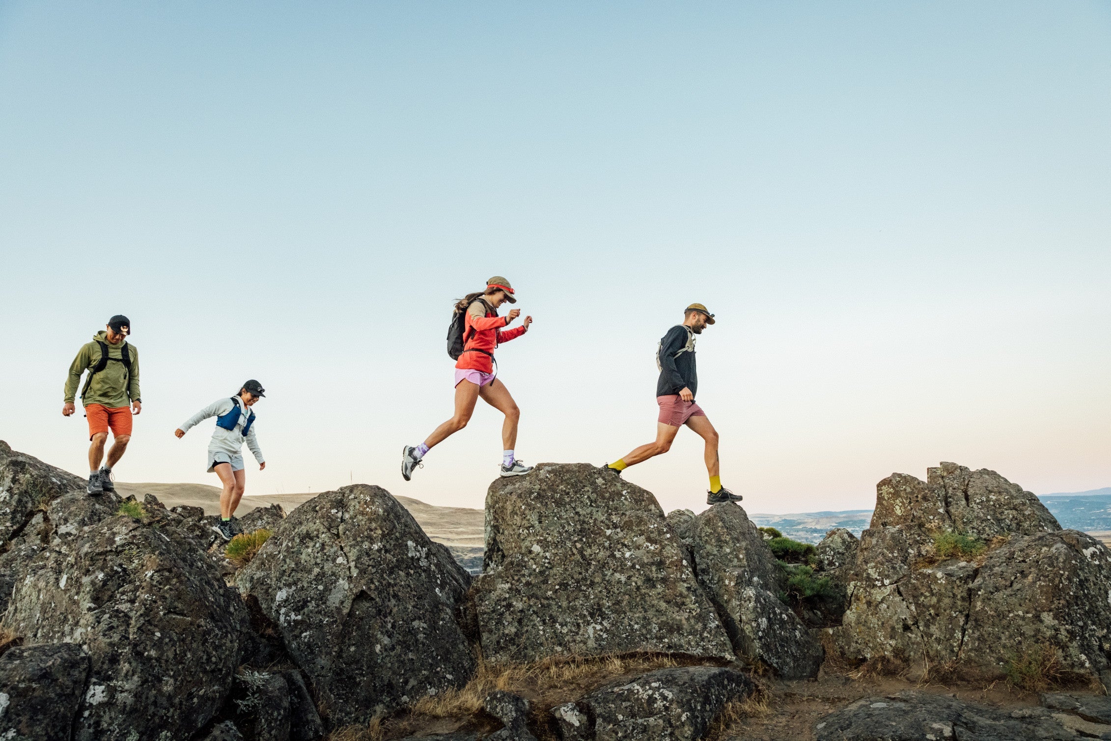 group hiking on rocks
