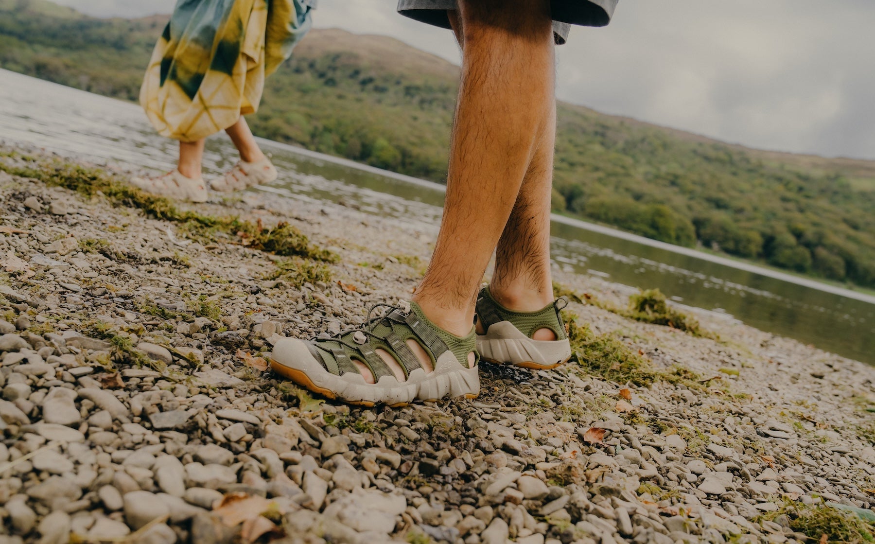 person wearing Newport on pebbles