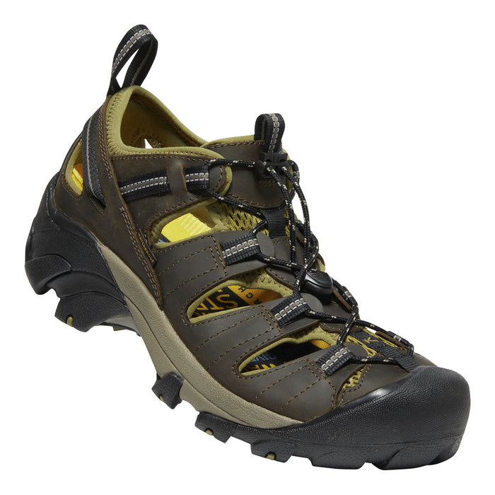 Brown hiking shoe/sandal with black sole on a white background