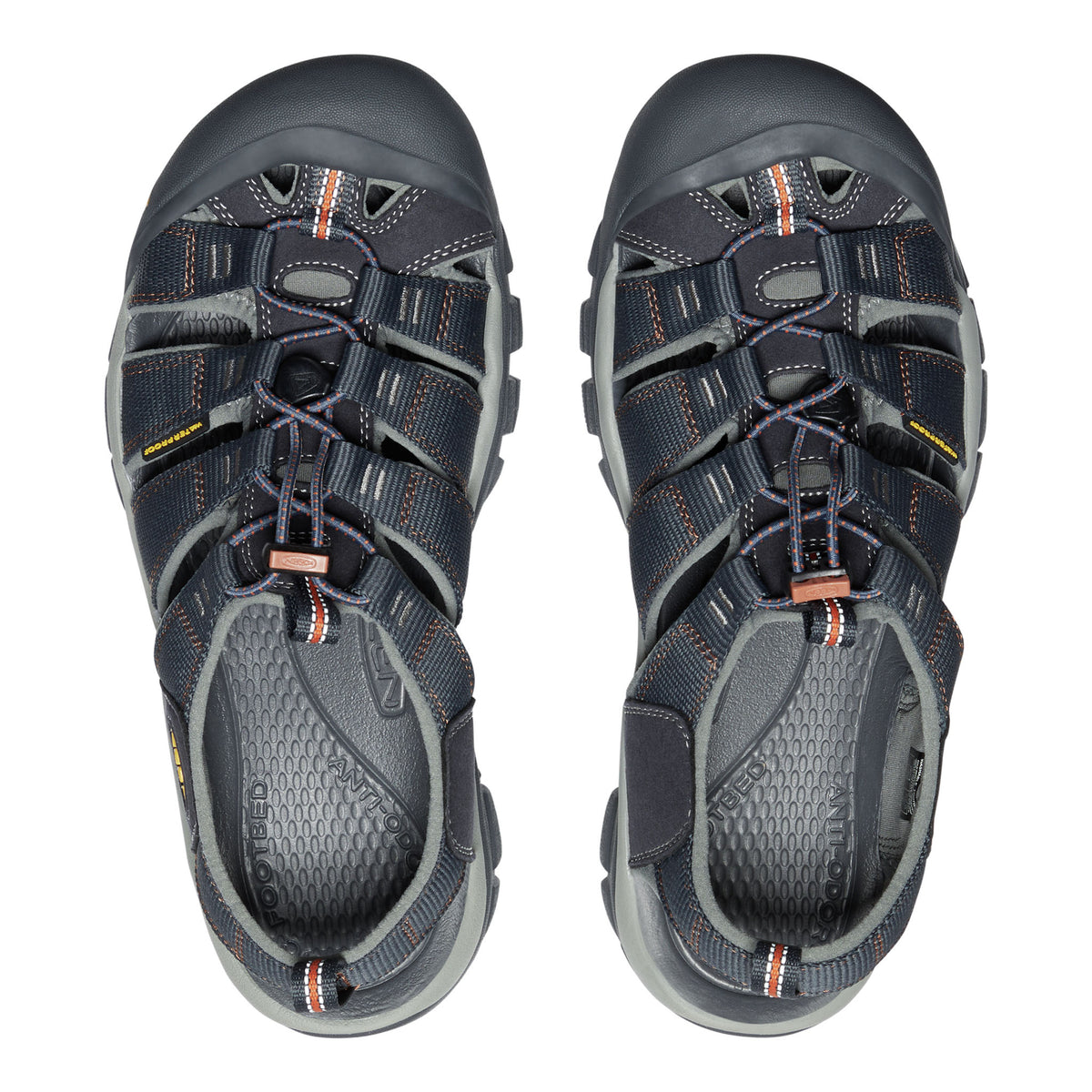 Pair of gray sandals with orange accents on a white background
