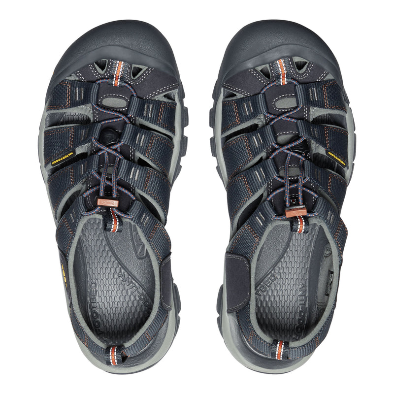 Pair of gray sandals with orange accents on a white background