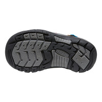 Close-up of a black and gray shoe sole with KEDS branding on a white background