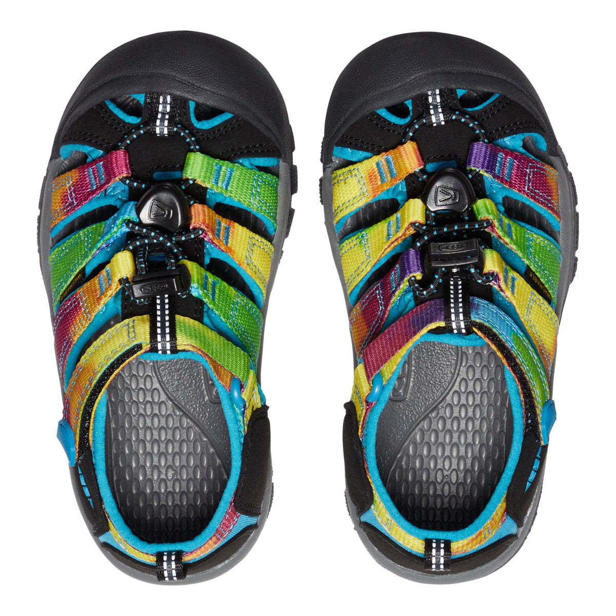 Colorful children's sandals with black soles on a white background