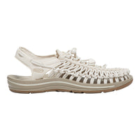 White sandal with woven design on a white background