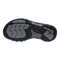 Close-up of a black and gray shoe sole with 'Keen' branding on a white background