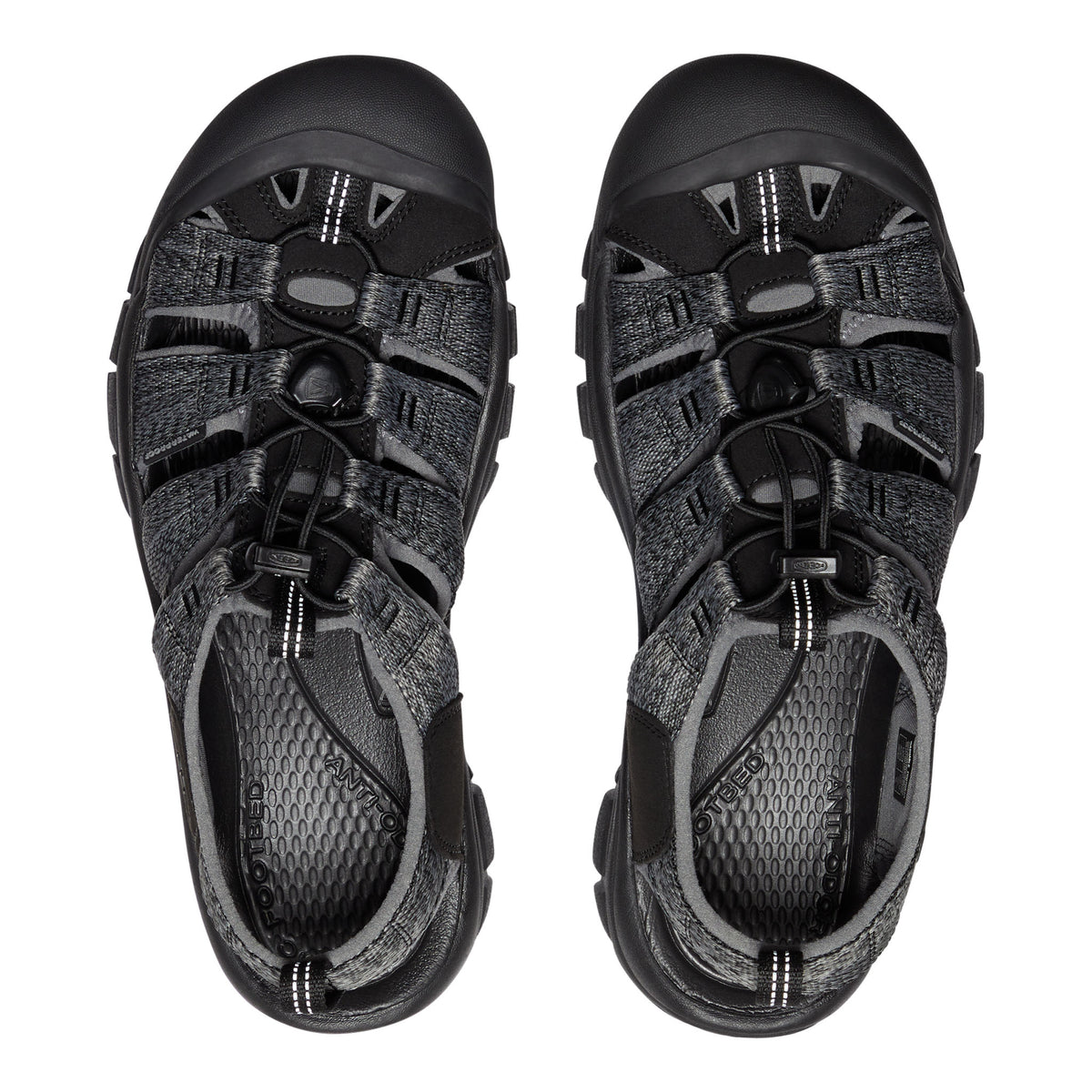 Pair of black sandals with multiple straps on a white background