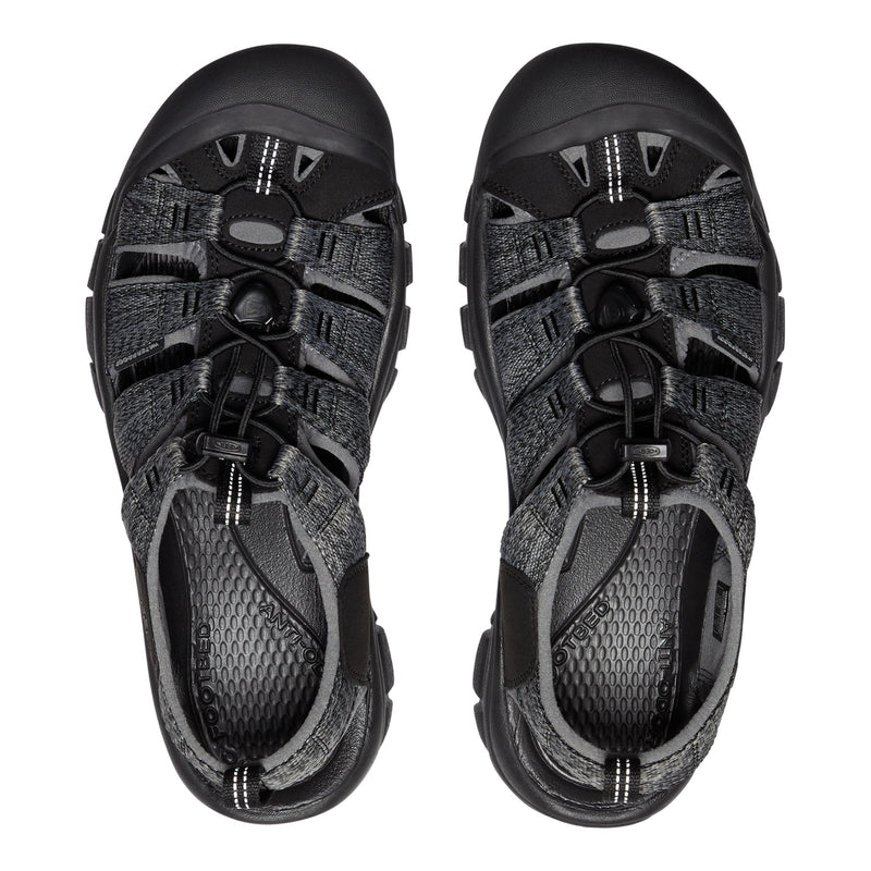 Pair of black sandals with multiple straps on a white background