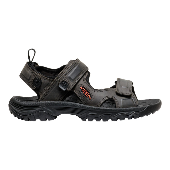 Black sandal with strap design on a white background