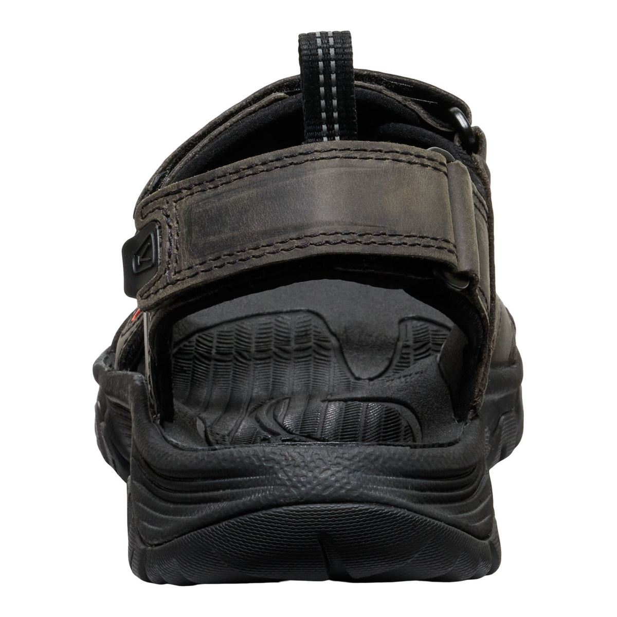 Black sandal with a thick sole on a white background