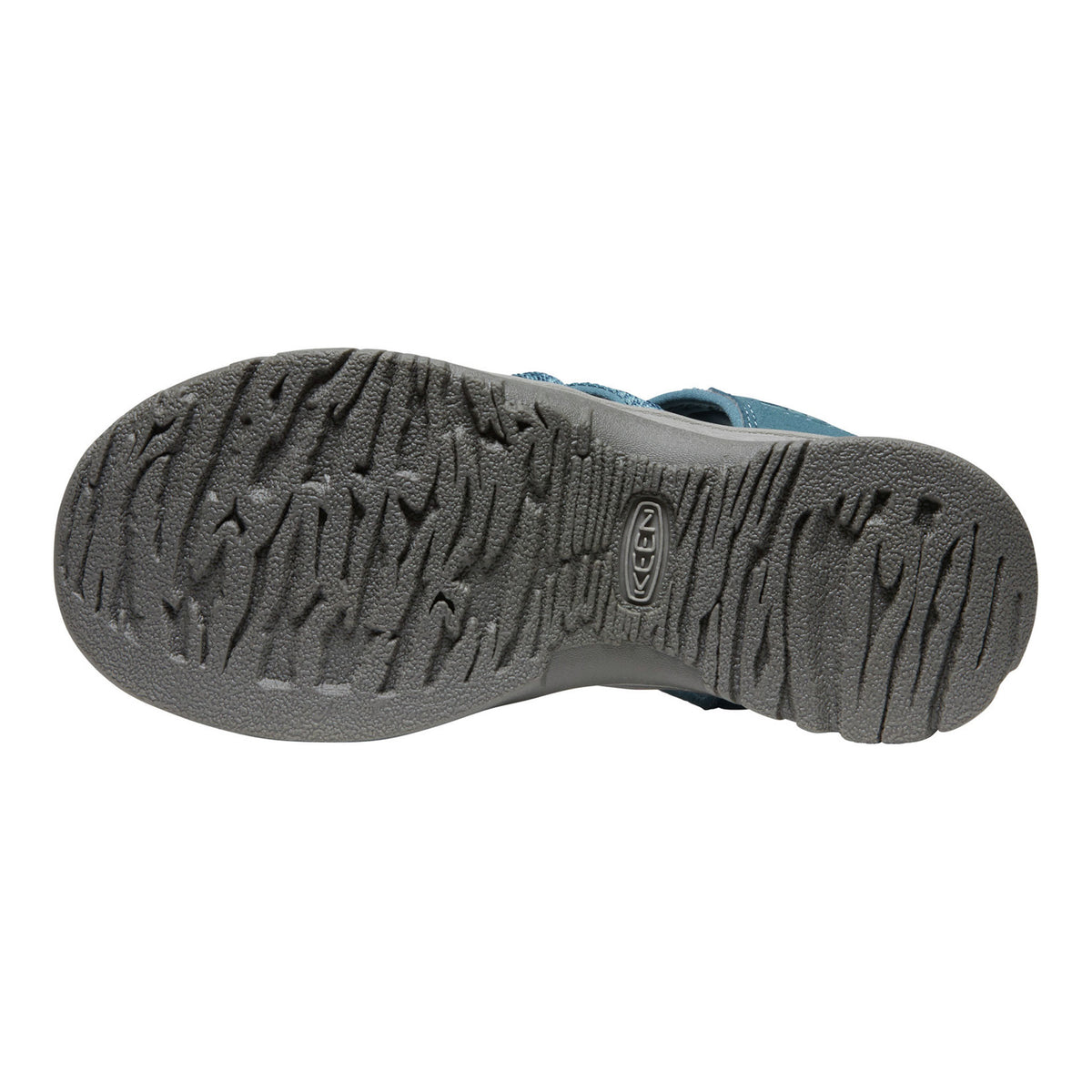 Close-up of a shoe sole with tread pattern on a white background