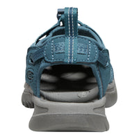 Blue sandal with gray sole on a white background