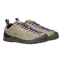 Keen brand low-top hiking shoes in beige suede with purple laces and purple heel pulls, shown on a plain white background.