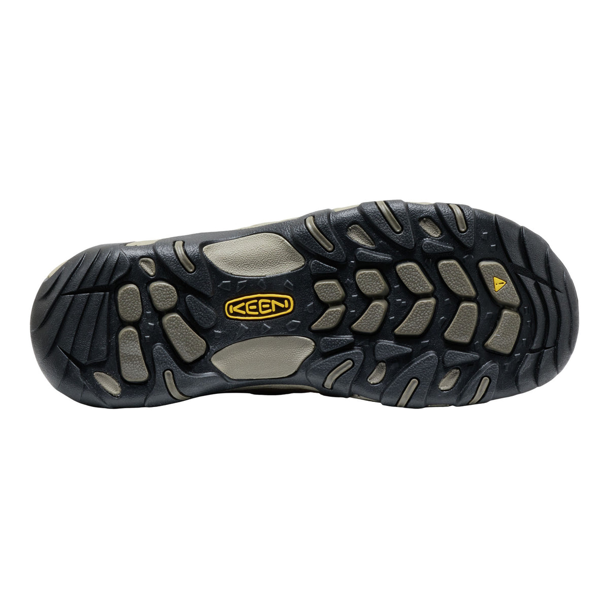 The outsole of a Keen hiking boot, showing a black tread pattern with gray protective rubber inserts and a yellow Keen logo in the center.