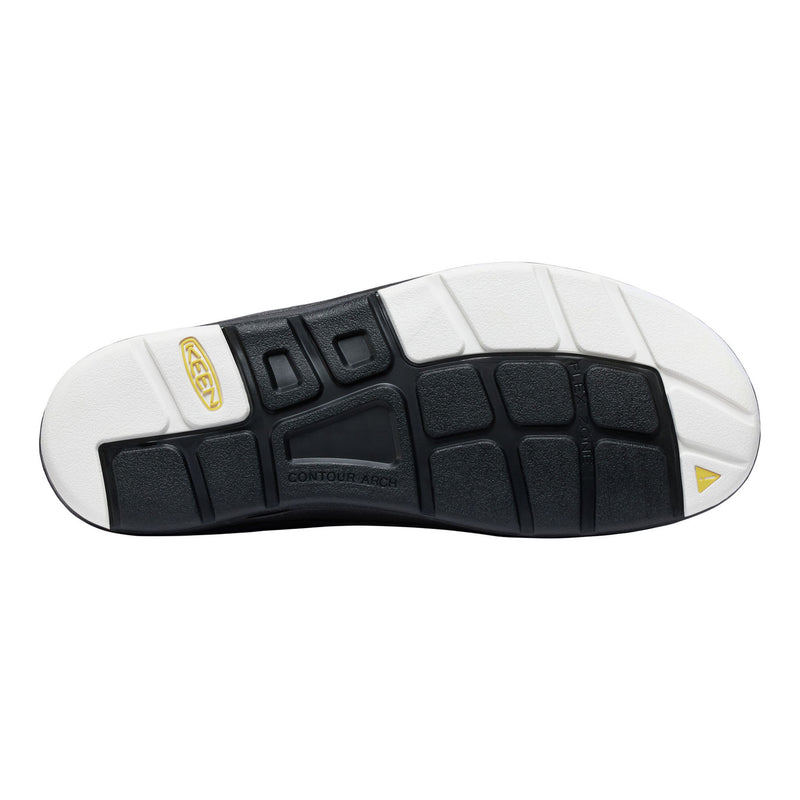 Close-up of a shoe sole with white and black design on a white background
