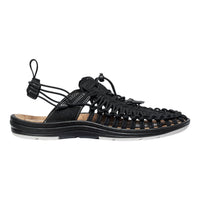 Black sandal with unique sole design on a white background