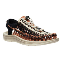 Woven sandal with black and brown straps on a white background