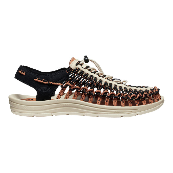 Black and brown sandal with unique sole design on a white background
