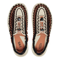 Pair of Keen sandals with braided design on a white background