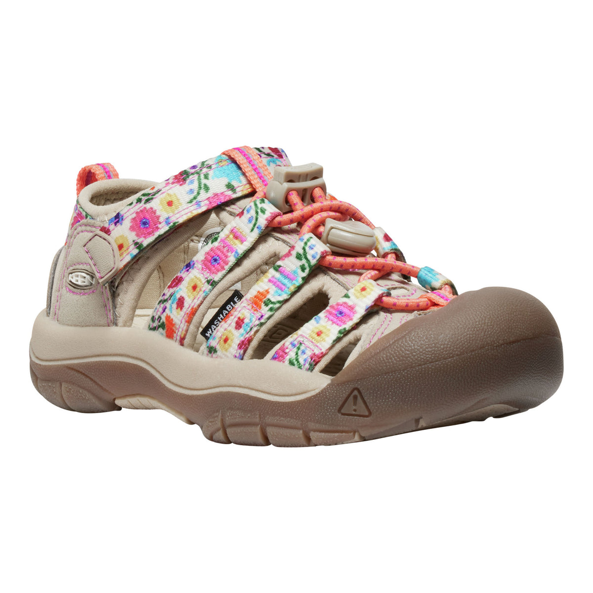 A K-Swiss children's sandal in beige with a colorful floral patterned strap and coral-pink laces, shown from a side profile on a white background.