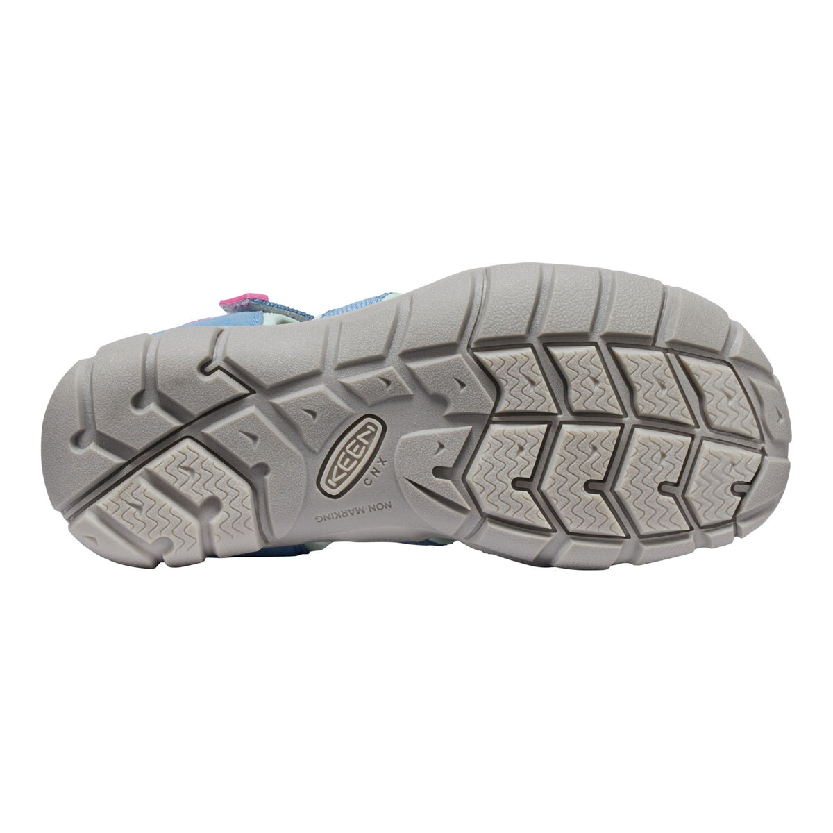 Close-up of a shoe sole with a brand logo on a white background