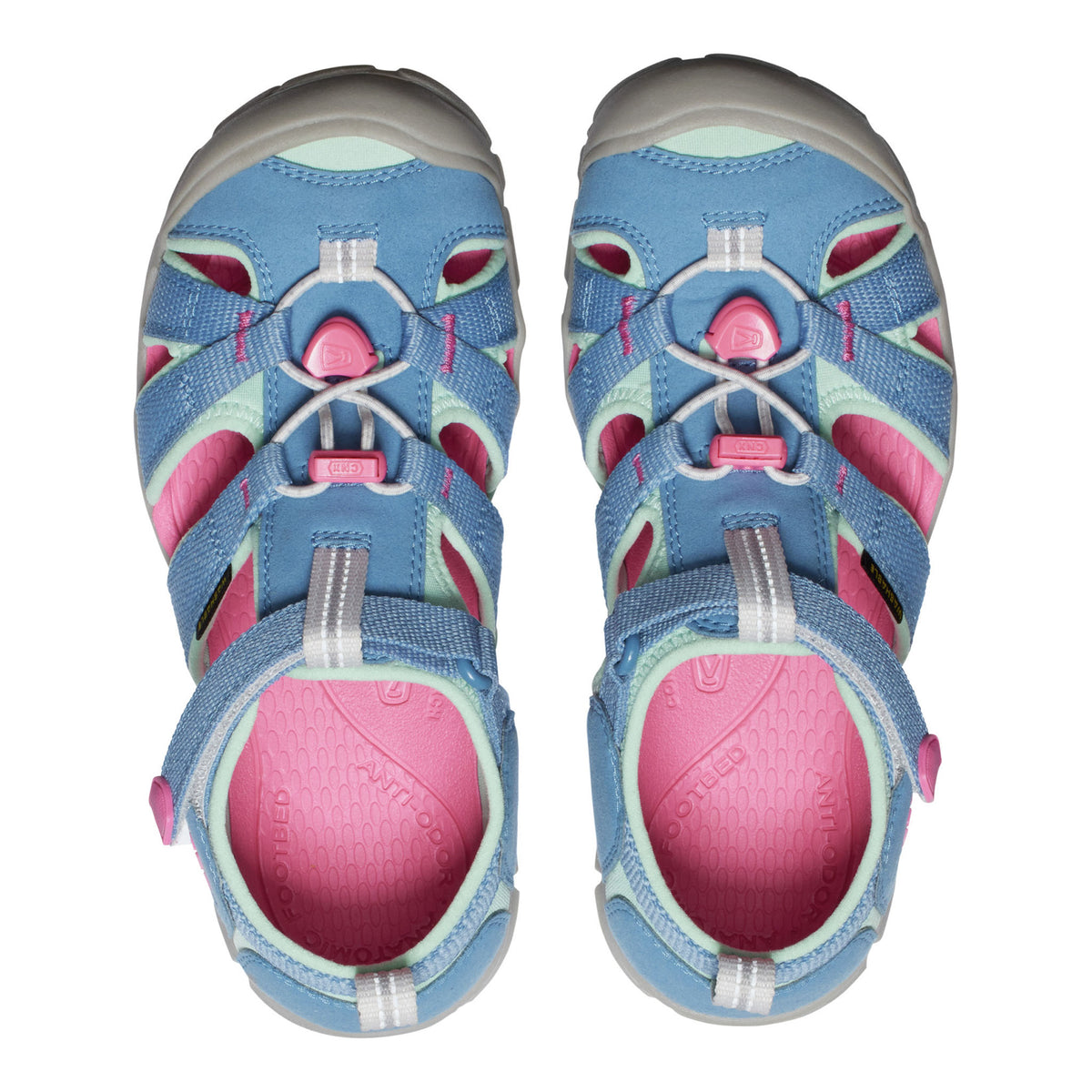 Pair of blue and pink sandals on a white background