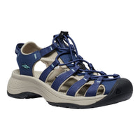 Blue and beige sandal with lace-up design on a white background