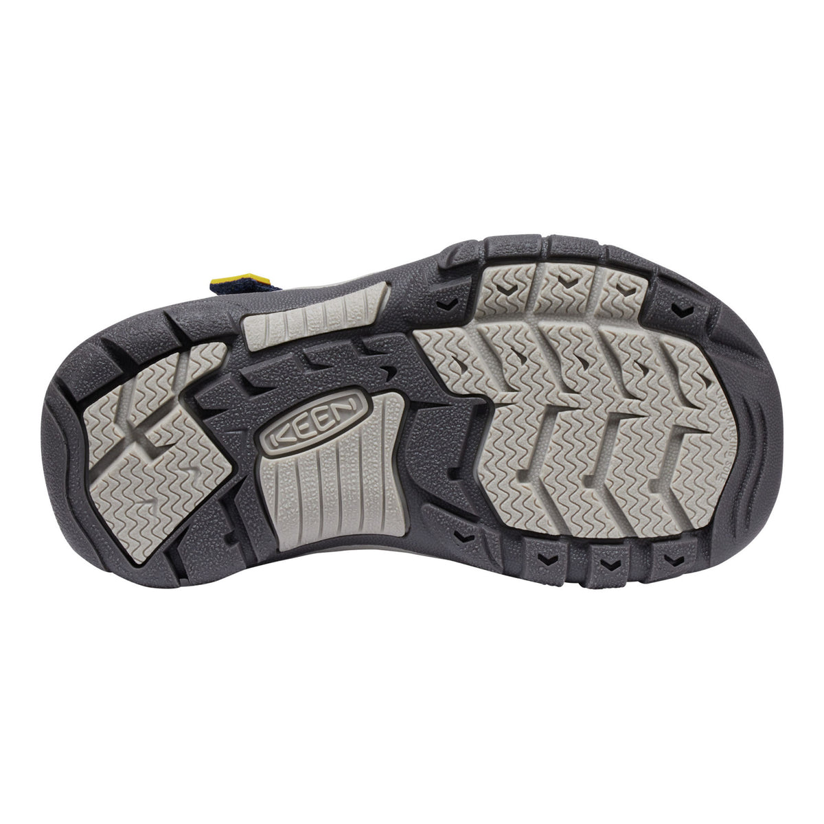 The outsole of a Keen hiking shoe, showing a black and gray tread pattern with the Keen logo embossed in the center, on a white background.