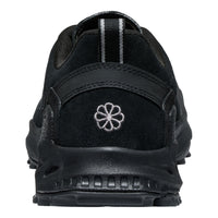 Black shoe with a floral logo on a white background