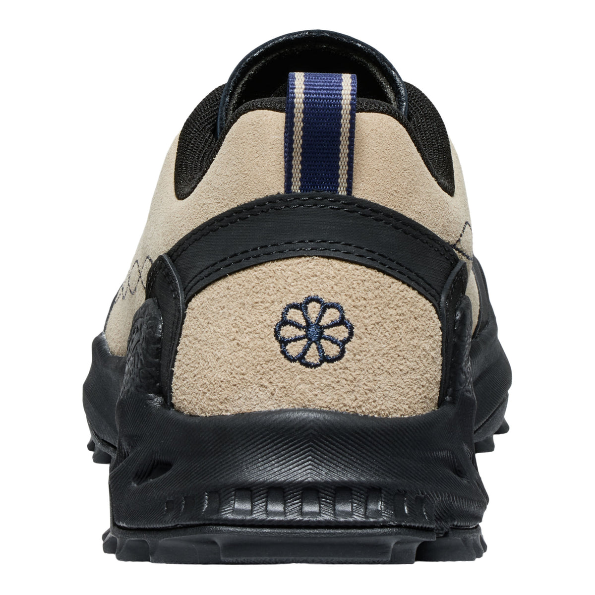 Back view of a black and beige shoe with a brand logo on a white background