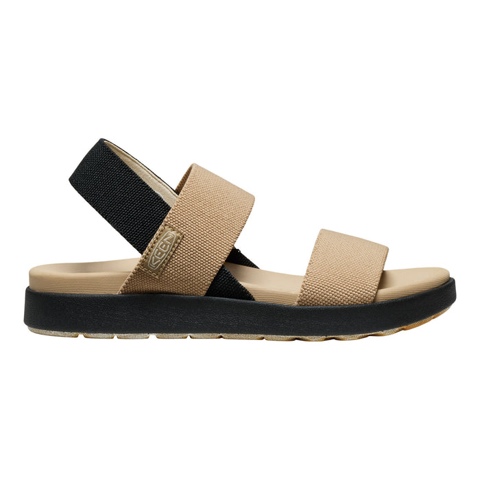 A single women's platform sandal shown in a side profile on a white background. The sandal features a thick black platform sole, a beige fabric upper strap, a black elastic ankle strap, and a beige footbed.