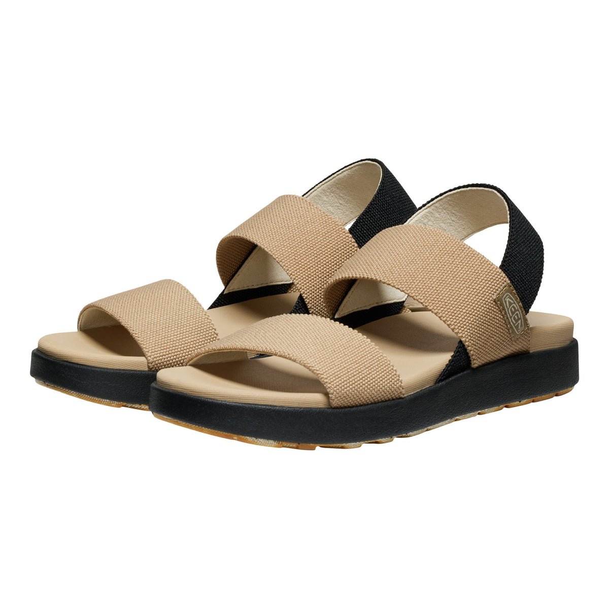 A pair of women's slide sandals with beige woven straps, a beige footbed, and a black platform sole, shown against a plain white background.