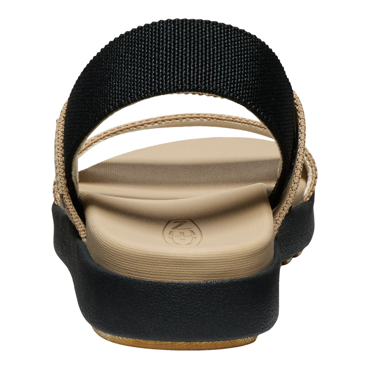 A single women's flat sandal shown from a top-down view on a white background. The sandal features a wide, adjustable black elastic strap, a beige fabric-wrapped edge, a beige contoured footbed, and a thick black platform sole with a tan outsole.