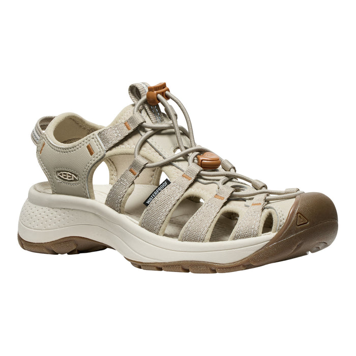 Beige sandal with brown accents on a white background