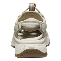 Beige sandal with brown sole on a white background