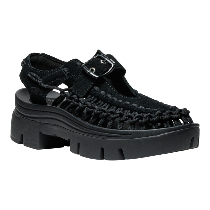 Black sandal with thick sole on a white background