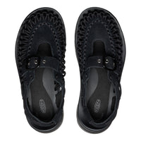 Black sandals with woven design on a white background