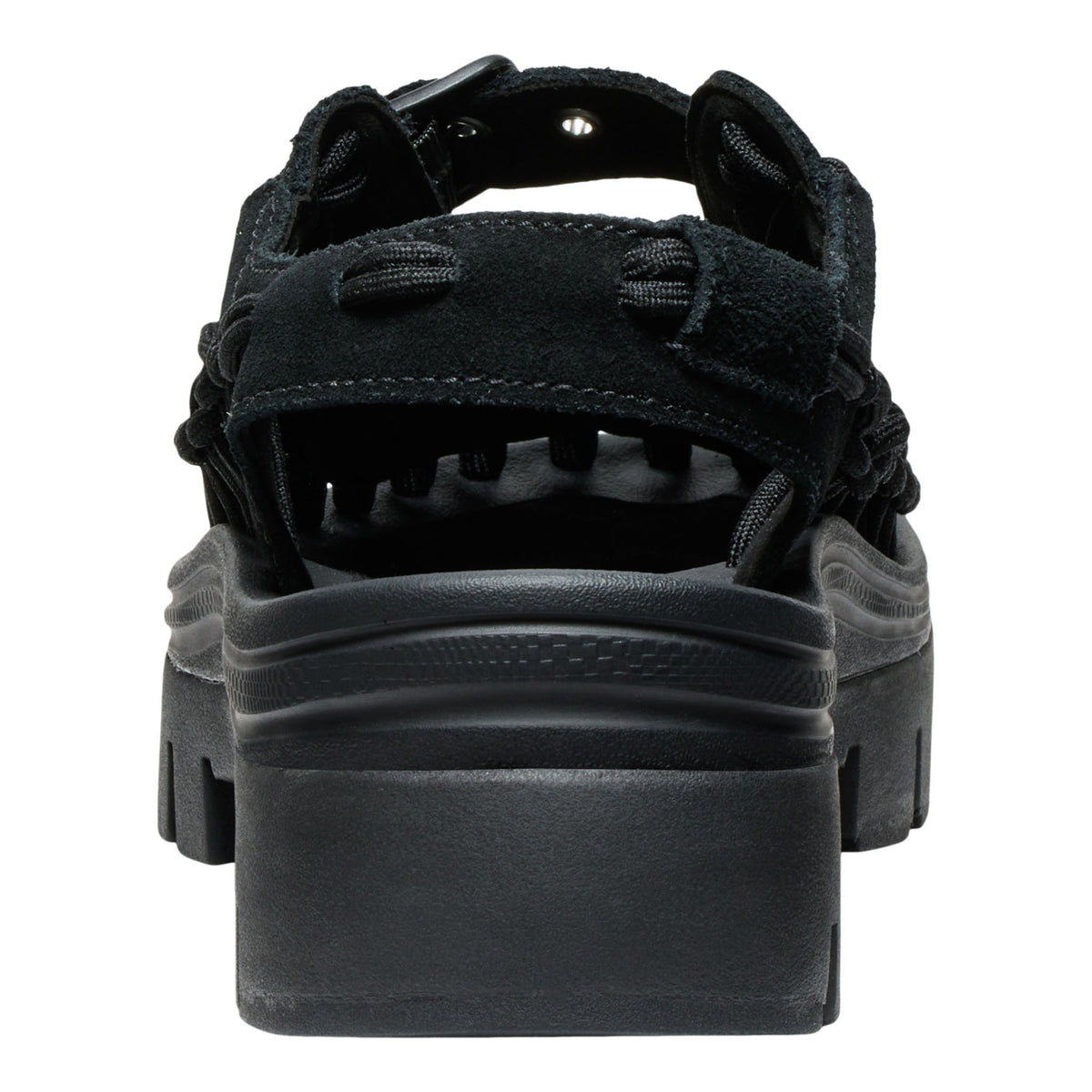 Black sandal with thick sole on a white background