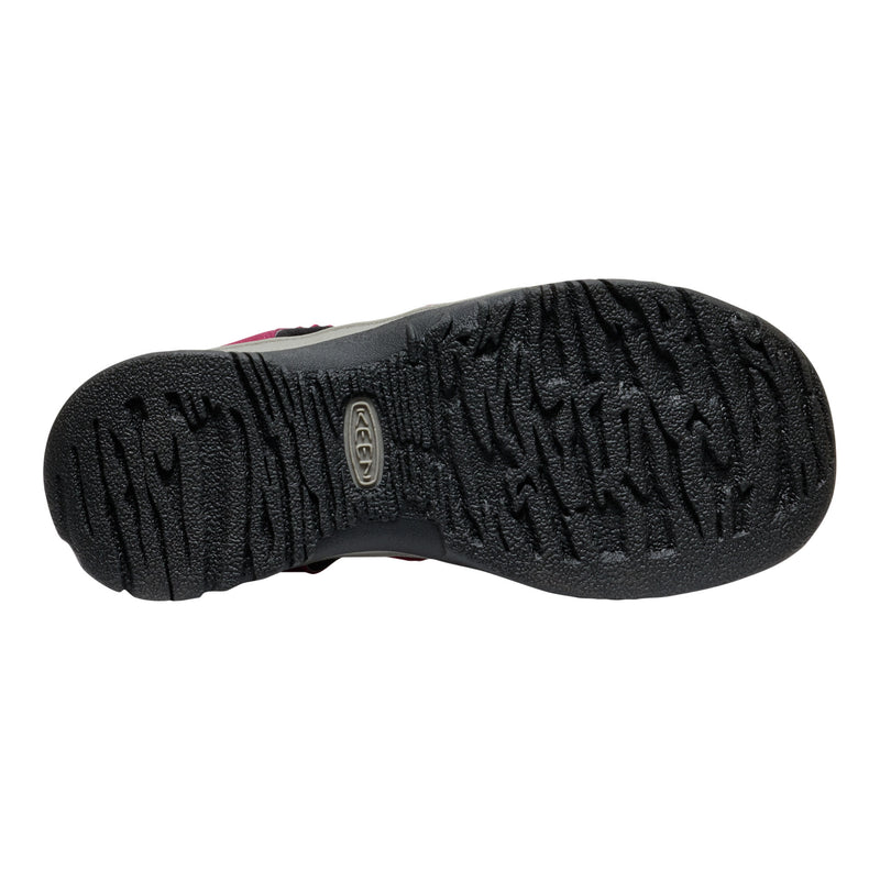 Black sole of a shoe with a brand logo on a white background