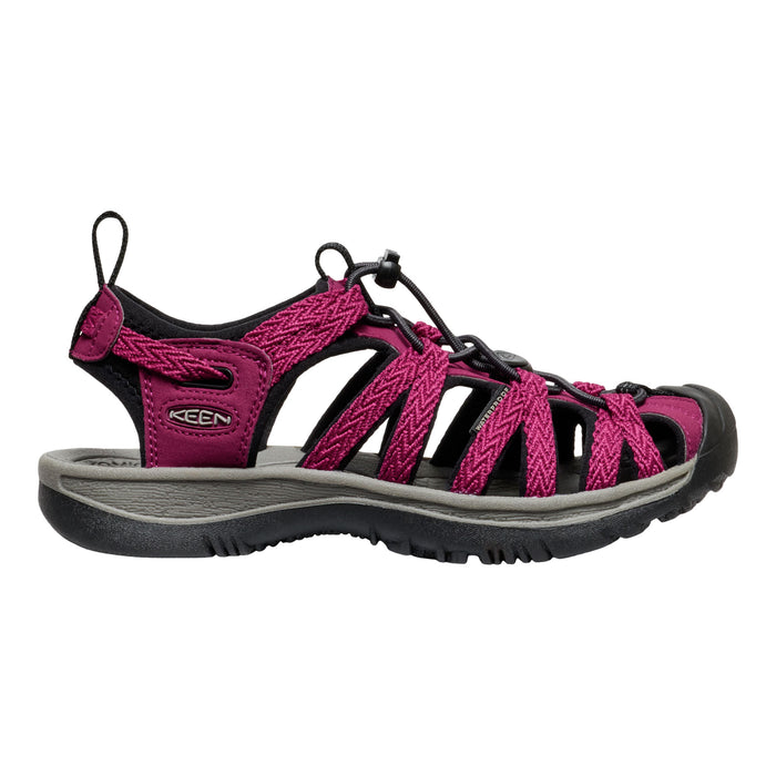 Pink and black sandal with KEEN logo on a white background