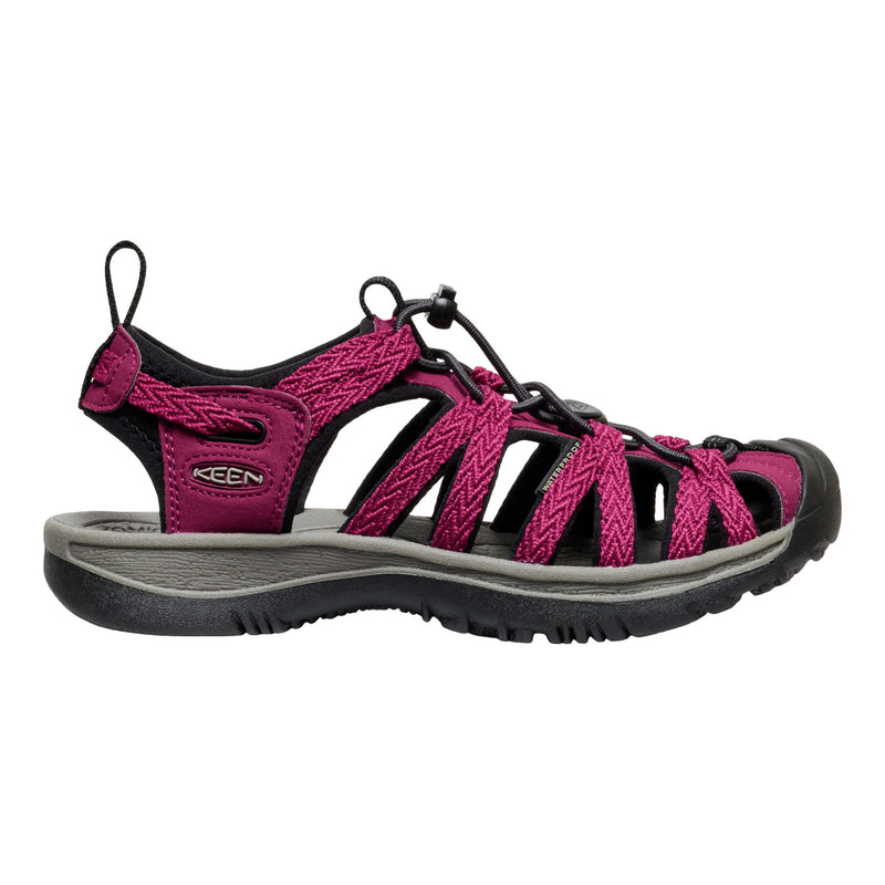 Pink and black sandal with KEEN logo on a white background