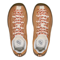 Pair of brown KEEN shoes with white soles on a white background