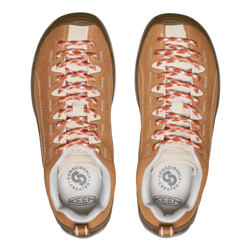 Pair of brown KEEN shoes with white soles on a white background