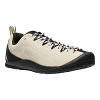 Beige and black hiking shoe on a white background