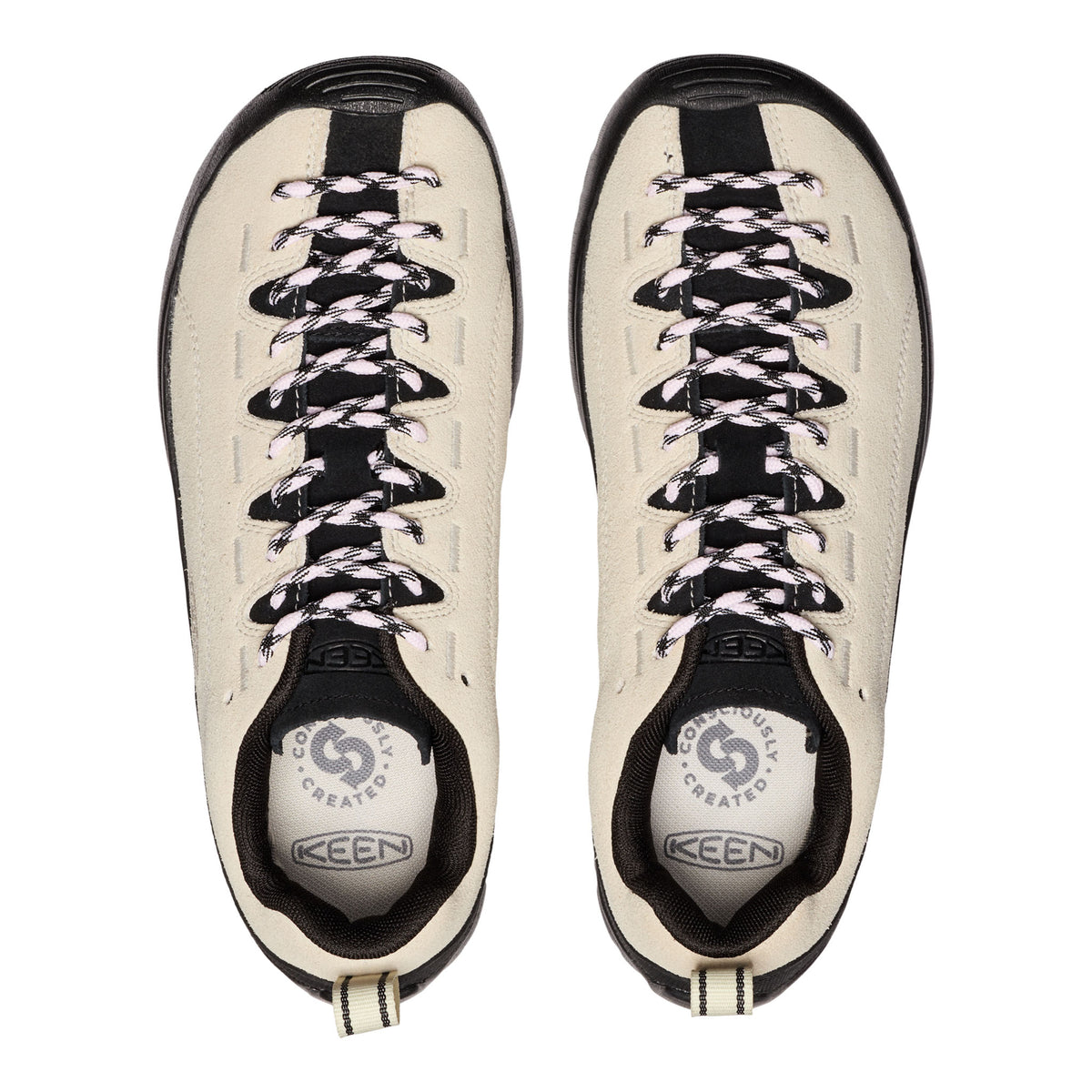 Pair of white sneakers with black accents and laces on a white background