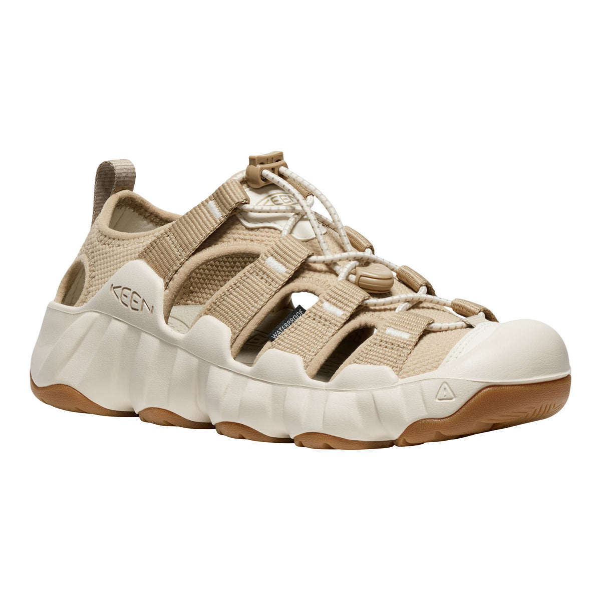A Keen brand platform sandal in beige and off-white, featuring wide adjustable straps, a thick textured sole, and a gum outsole, shown against a plain white background.