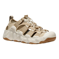 A Keen brand platform sandal in beige and off-white, featuring wide adjustable straps, a thick textured sole, and a gum outsole, shown against a plain white background.