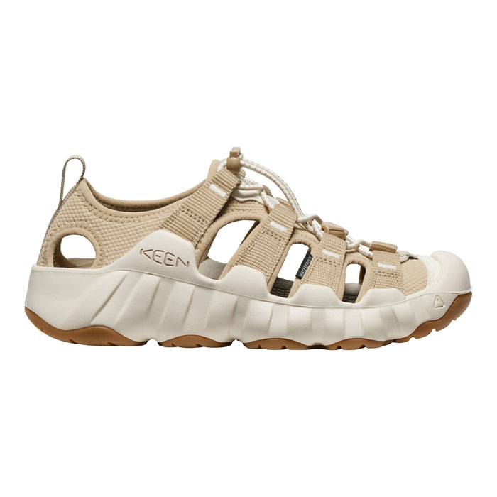 A Keen brand water sandal in beige and off-white, shown from a side profile view against a plain white background.