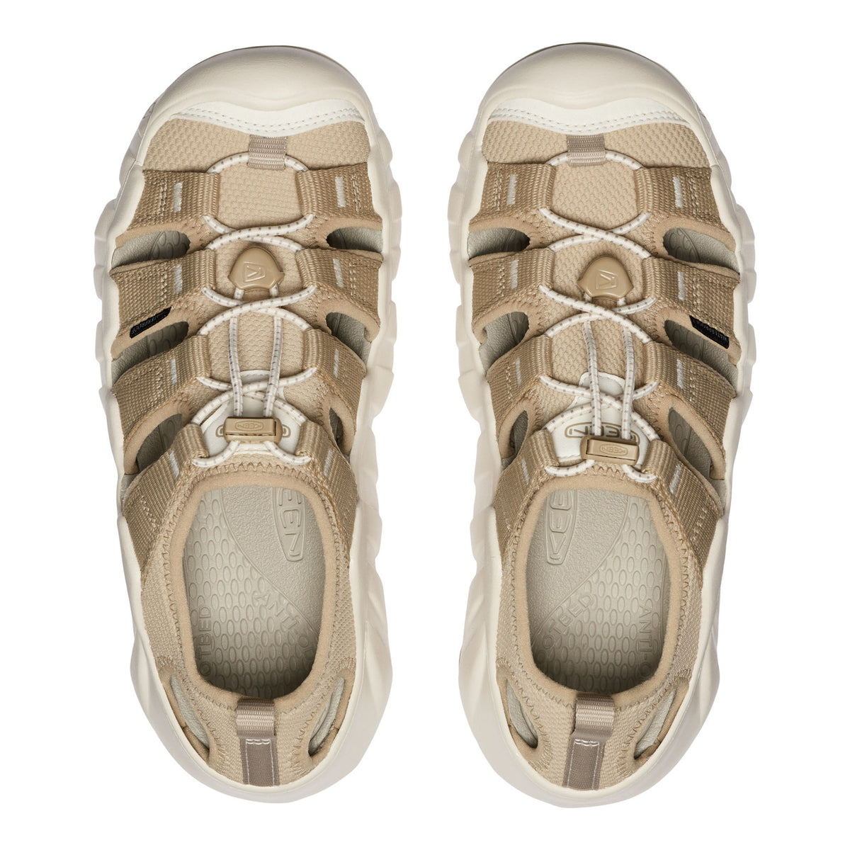 A pair of K-Swiss water shoes in beige and off-white, shown from a top-down view on a solid white background.
