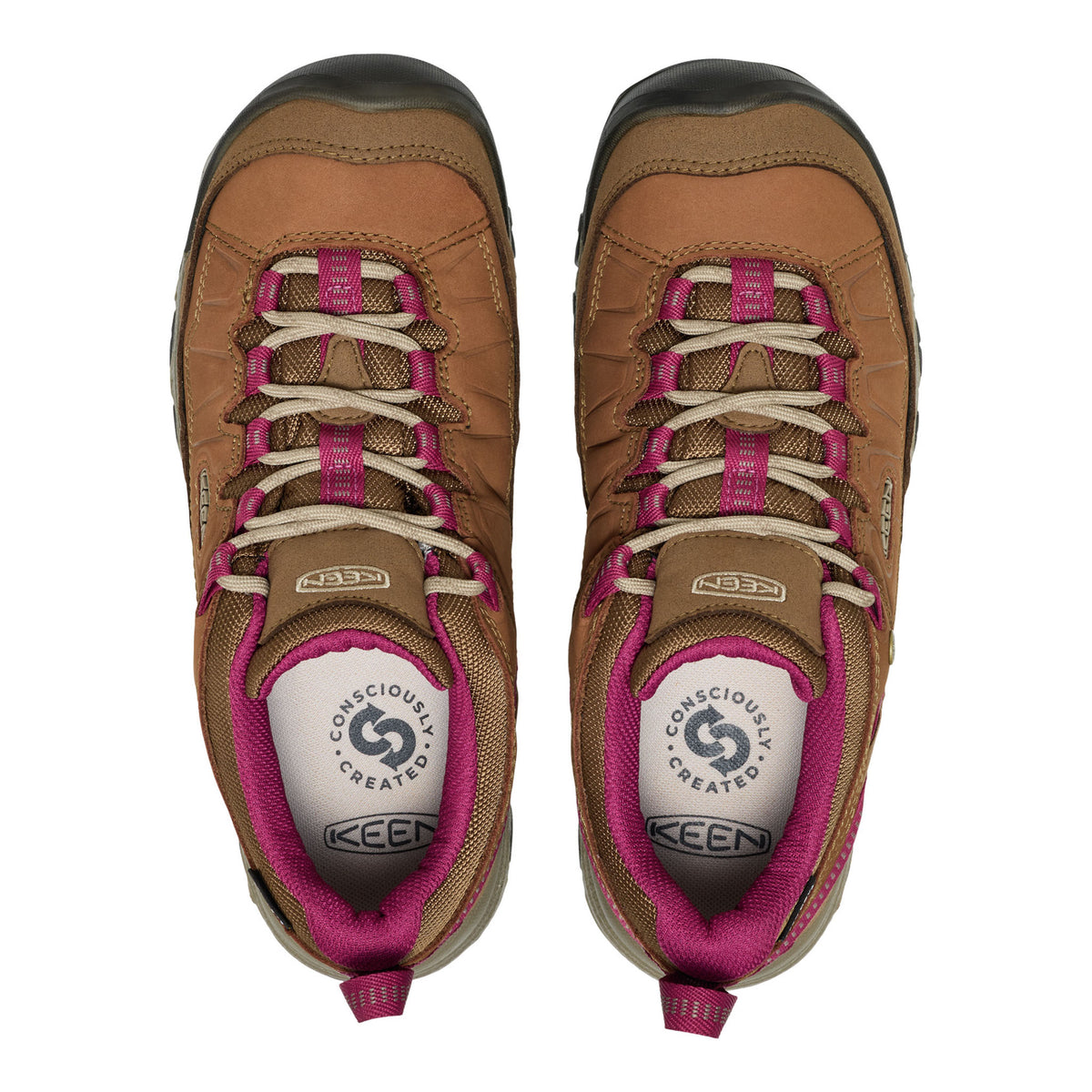 A pair of Keen hiking shoes shown from a top-down view, featuring a tan and brown leather and mesh upper with bright pink laces and lining, and a white tongue insert.