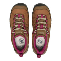 A pair of Keen hiking shoes shown from a top-down view, featuring a tan and brown leather and mesh upper with bright pink laces and lining, and a white tongue insert.